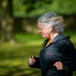 physiotherapist guiding patient through resistance exercise for osteoporosis